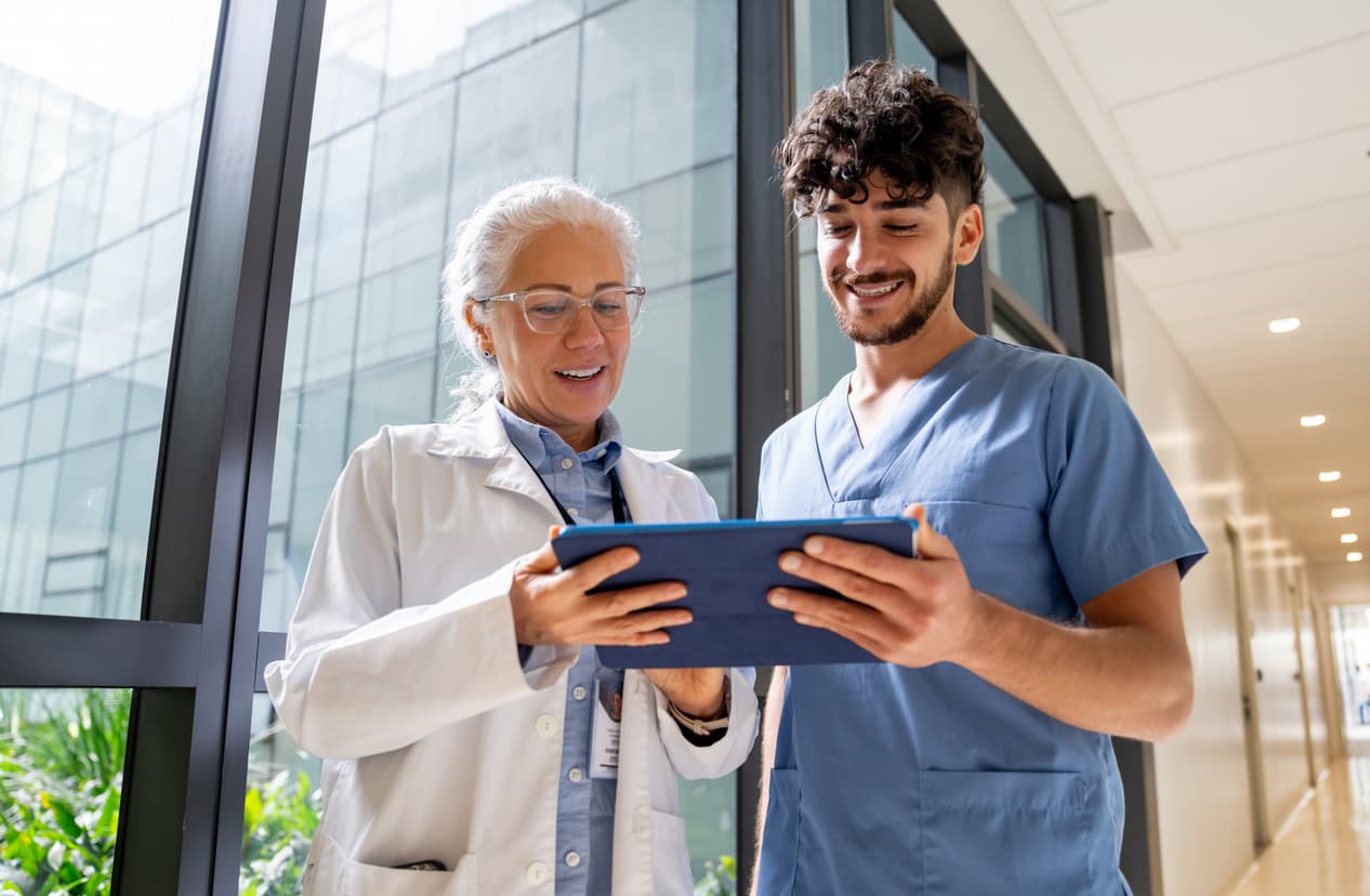 Healthcare professionals reviewing financial data on a tablet